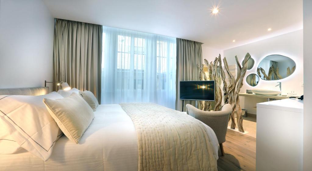 Petit Hôtel Confidentiel — a light-filled bedroom