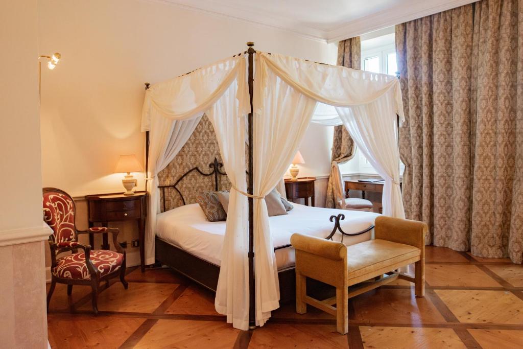 Château des Comtes de Challes — a four-poster bedroom